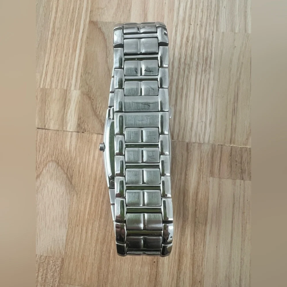 Citizen eco-drive rectangular black dial silver tone solar dress watch